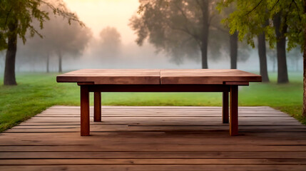 Fototapeta premium Wooden table on the background of the evening foggy park
