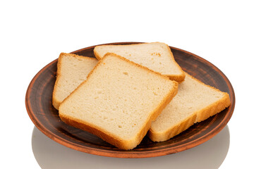 Several pieces of white toaster bread on a clay plate, macro, isolated on white background.