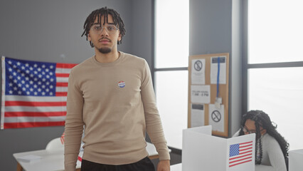 Man and woman in a room with an american flag, symbolizing voting in the united states.