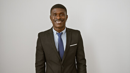 Handsome businessman in a suit smiling against a white background