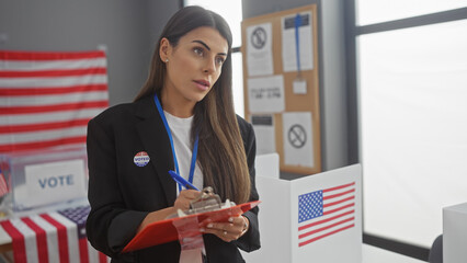 Hispanic woman taking notes at an american electoral college polling station, adorned with flags.