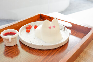Rabbit pudding on plate in cafe,Bunny Jelly popular dessert in japan or korea,Japanese desserts,valentines day.