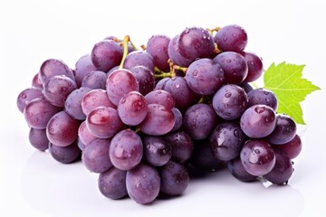 Fototapeta premium A bunch of fresh, ripe grapes with a green leaf.