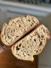 fresh artisan bread, sourdough bread, crusty bread, sliced loaf of bread, slices of bread, buttered slices of bread, coarse salt