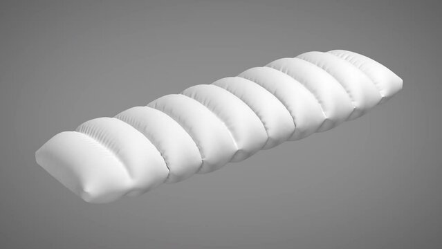 Wavy pillow inflated on green screen background.