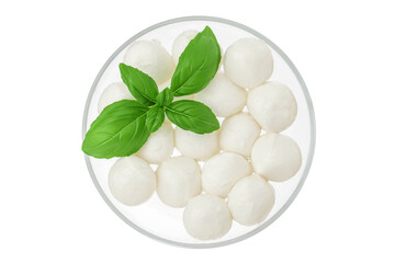 Mini mozzarella balls with basil leaf in a glass bowl isolated on white background. Top view. Flat...
