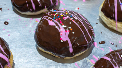 Bread topped with chocolate sprinkled with colorful sugar.