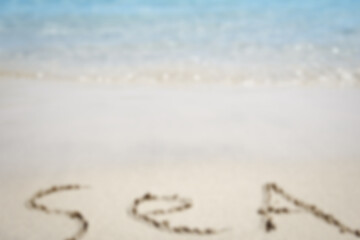 Beautiful drawing on the sand of the sea background