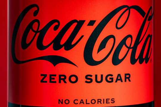 Label and trademark on plastic bottle of Zero Coca-Cola on red background. Coca-Cola is one of the most popular soda products in the world