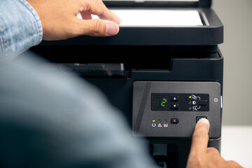 The man using the laser printer.