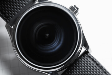 Smartwatch with blurred black clock face, abstract time concept