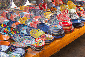 Colorful handmade Uzbek plates and bowls with traditional patterns