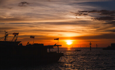 Silhuettes of Malaysian fishing boats at sunset