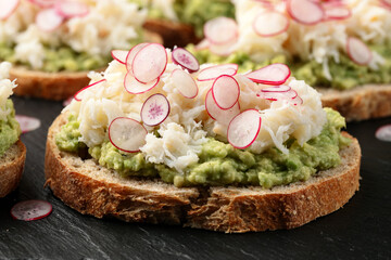 Crab meat and smashed avocado and radishes Sourdough bread toasts