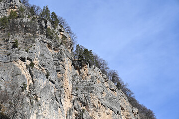 Landscape with rocky mountain against blue sky