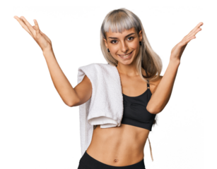 Caucasian young woman in sportswear receiving a pleasant surprise, excited and raising hands.