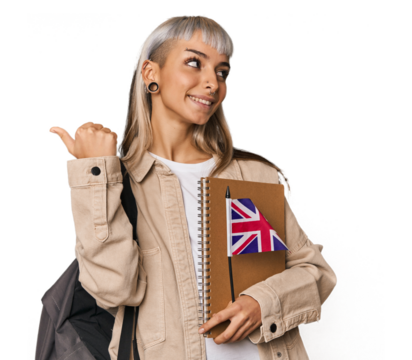 Young erasmus student with books points with thumb finger away, laughing and carefree.