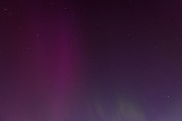 CARNIKAVA, LATVIA. 11th May 2024. Selective focus photo. Impressive northern lights, aurora borealis in the sky.