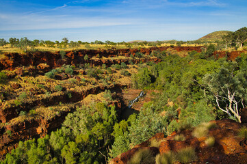 View of the spectacular Dales Gorge, carved into the iron-rich red rocks of the savannah landscape of Karijini National Park, Western Australia
