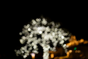 Decorative outdoor string lights at night time, Defocused Background, night city life backdrop,...