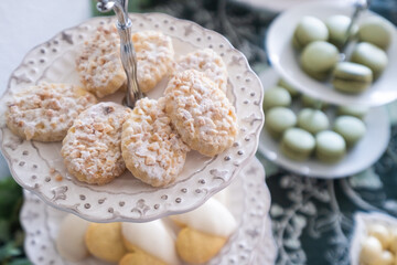 detail of a Candy table. Sweets on a festive celebration table. There are cookies, chocolates, chocolate eggs, cakes and different kind of candies