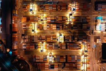 Ship harbor aerial night shot, container aerial view with drone. view of the big harbor