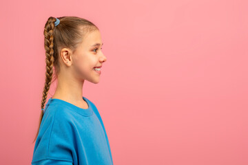 A young girl with a neatly braided hairdo is featured in this portrait. Her braid is prominently...