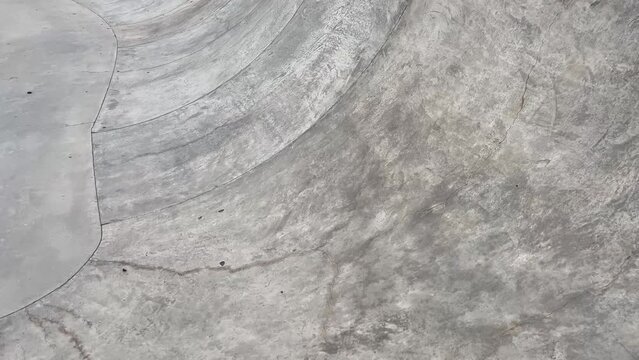 Public playground for a skateboard in a recreation park. No people.