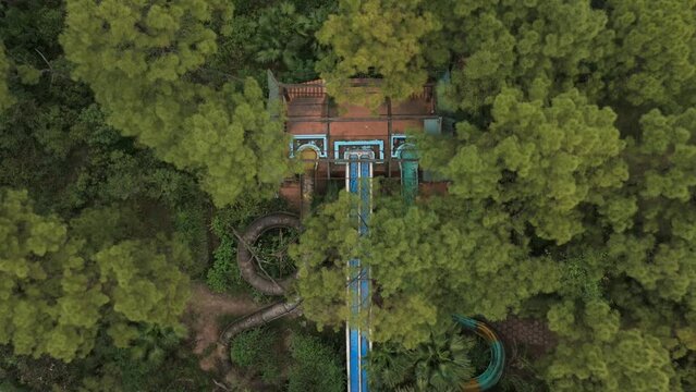 Flying over water slides in an abandoned waterpark