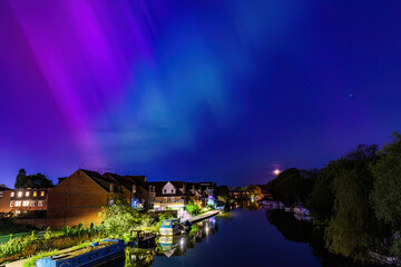 Fototapeta premium the unusual astronomy event, Aurora Northern Light in Downtown center of Caversham of Reading, Berkshire, England, summer 2024