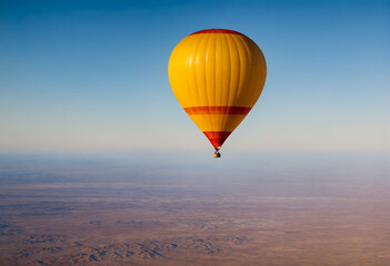 Fototapeta premium Hot air balloon flying in sky over landscape