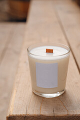 Scented candles on a wooden table. 