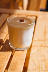 Scented candles on a wooden table. 