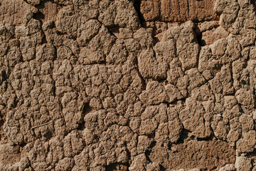 Wall of a traditional aged rural house made of clay
