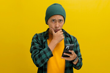 A puzzled and confused Asian man, dressed in a beanie hat and casual shirt, reacts to news on his...