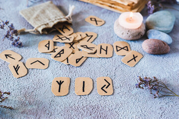 Prediction from three Scandinavian runes on a table in mystical decor