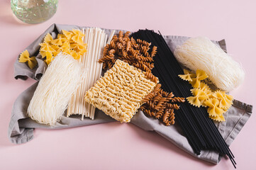 Funchoza, udon, black noodles, buckwheat and wheat pasta on a napkin