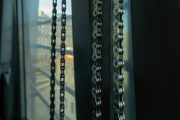 bicycle chain hanging on a hook and drying after cleaning