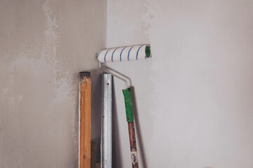 Primed with a roller with a primer putty wall before painting or gluing wallpaper. apartment...