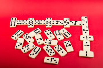 Dominoes with red background, copy space and various angles.