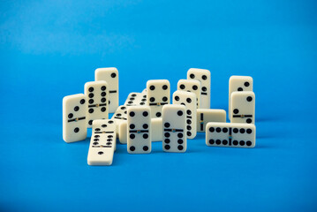 Dominoes with blue background, copy space and various angles.