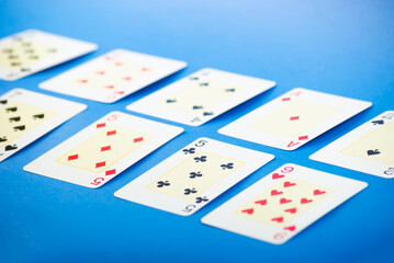 Playing cards isolated on blue background.