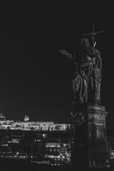 Fototapeta premium Amazing, scenic view to Lesser Town (Mala Strana), Prague Castle and Charles Bridge from the other side of Vltava river, illuminated by the city lights. Czech Republic
