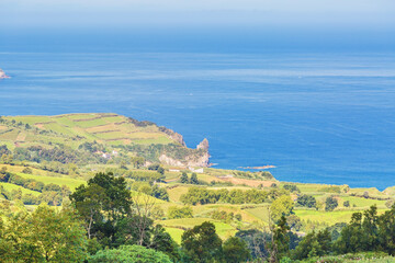 View on mountains, valleys, sea coastline of Sao Miguel island