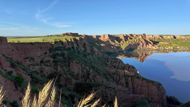 panoramic landscape of the Barrancas of Burujon of Toledo with the blue sky and the Castrej&oacute;n of Tagus River reservoir in the background