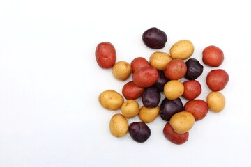 Potatoes, purple, white, red, vegetables on a white background, free space, place for text, top...