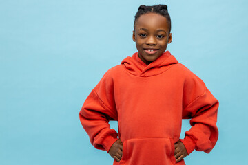 Confident smiling african american boy in orange hoodie