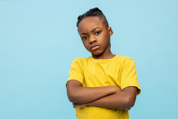 African american boy in yellow tshirt looking moody
