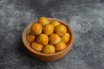 Nastar Cookies, Pineapple tarts or nanas tart are small, bite-size pastries filled or topped with pineapple jam, commonly found when Hari Raya or Eid Al Fitr or Lebaran. Selective focus.