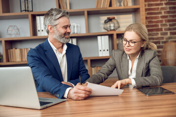 Male and female colleagues consulting in office psychotherapy sessions